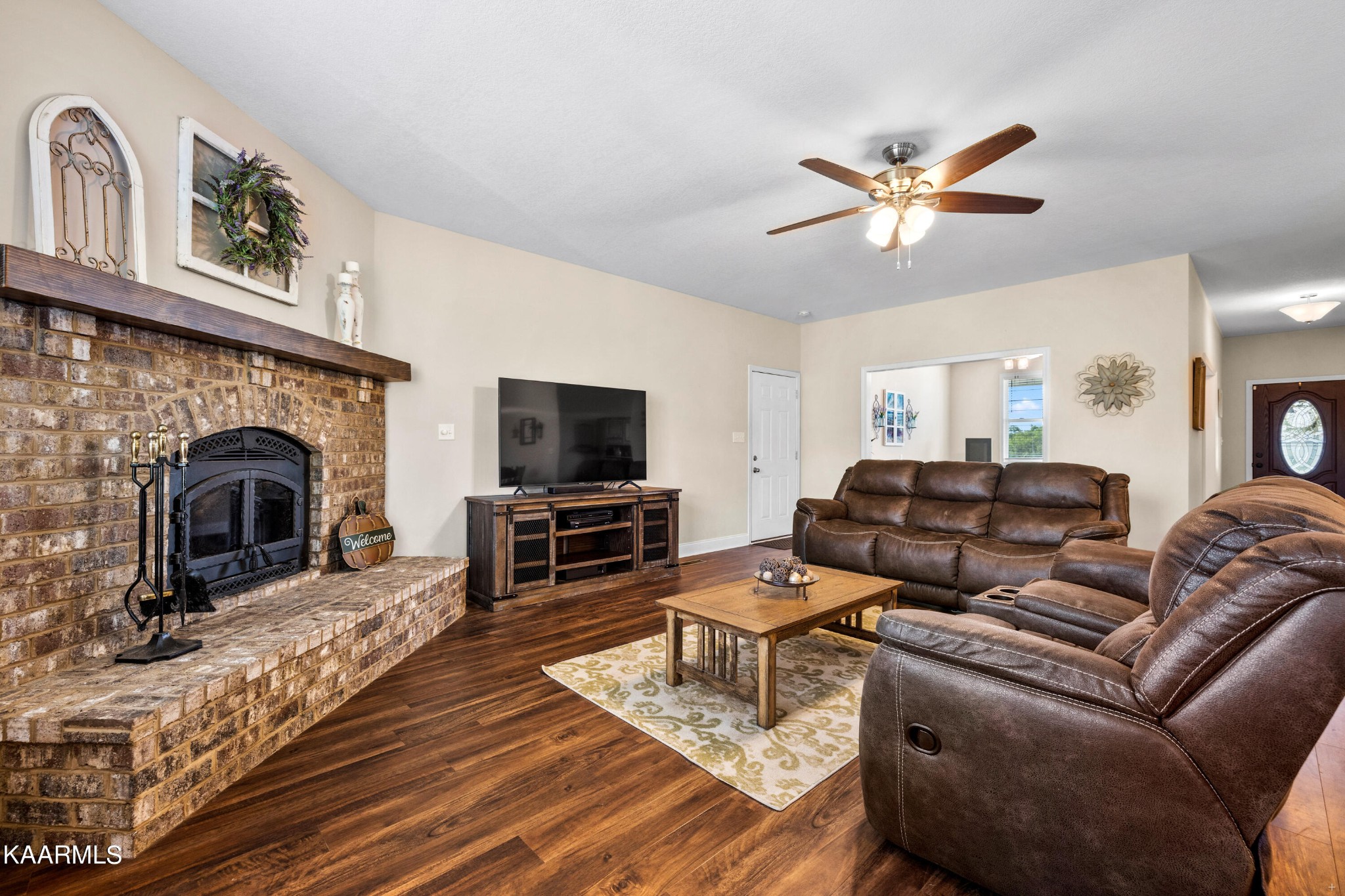 820 Kodak Road Kodak, TN 37764 - Photo 6 of 45 a living room with furniture a fireplace and a flat screen tv