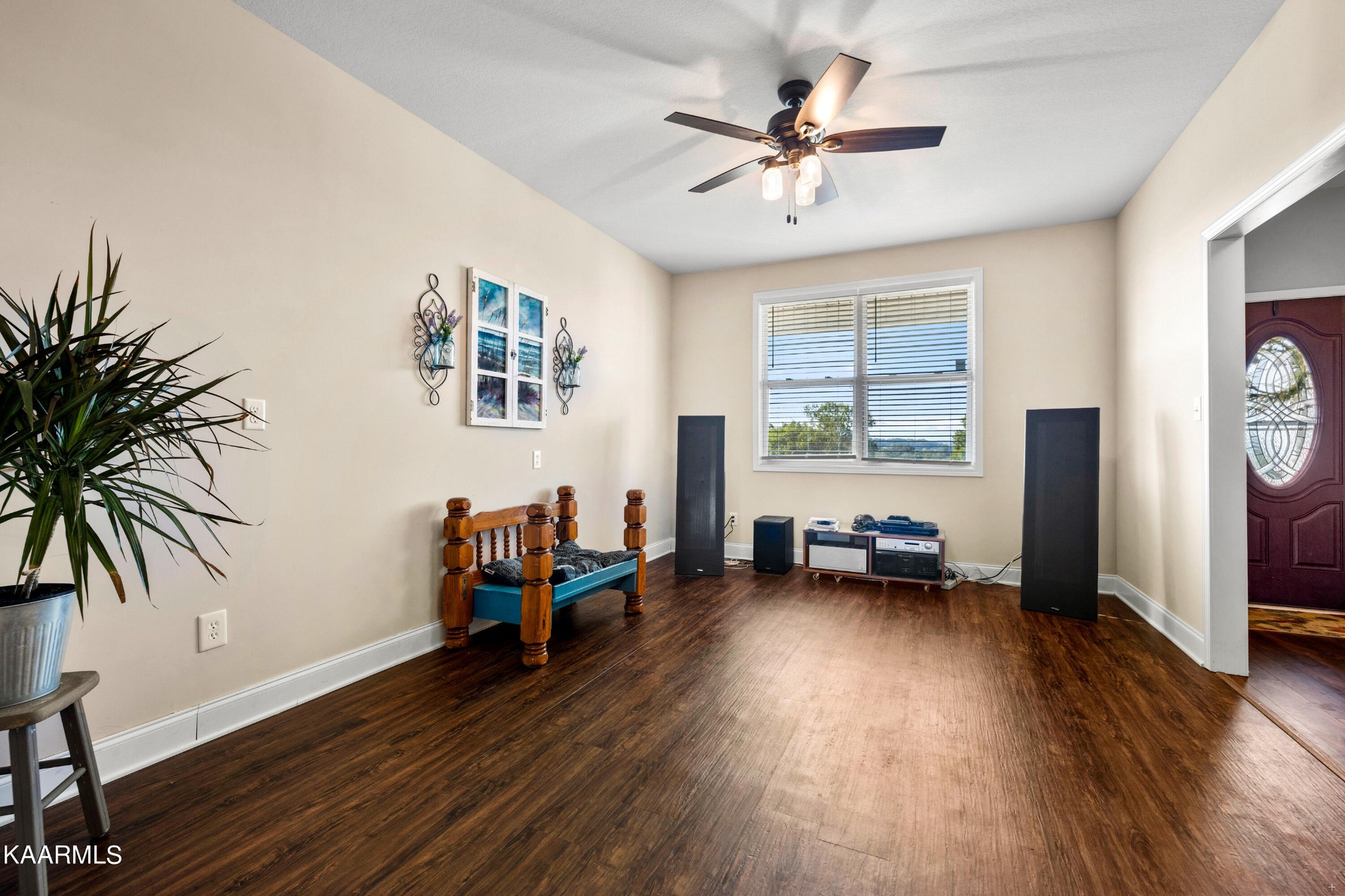 820 Kodak Road Kodak, TN 37764 - Photo 7 of 45 a view of a livingroom with furniture a ceiling fan and wooden floor