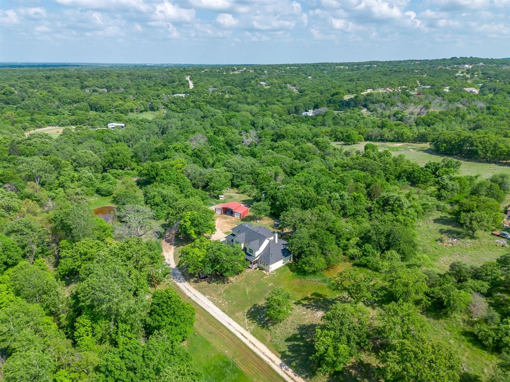 Just your little own slice of private paradise in Springtown! Check out the pond. Check out the barn. Check out the trees.