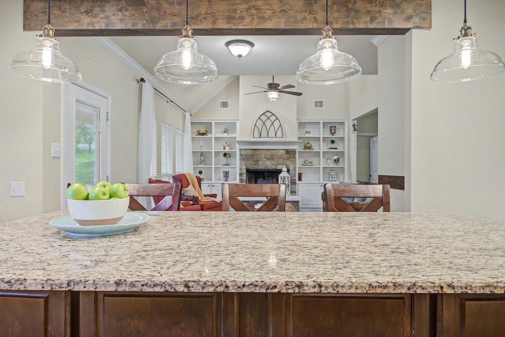 203 Saddle Ridge Court Springtown, TX 76082 - Photo 11 of 39 Love how these spaces are connected yet defined.