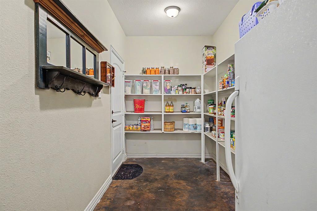 203 Saddle Ridge Court Springtown, TX 76082 - Photo 15 of 39 Did we mention the gigantic pantry? Go! Shop at Costco with wild abandon!