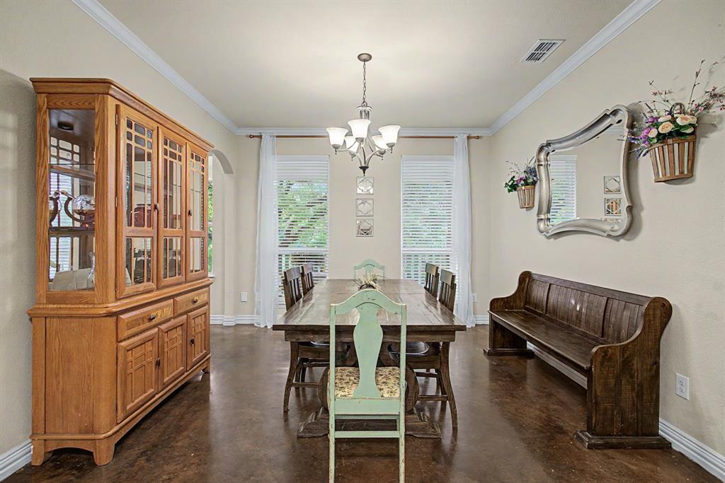 203 Saddle Ridge Court Springtown, TX 76082 - Photo 17 of 39 Formal dining room is SO spacious. Invite the whole family and everyone you know for the holidays.