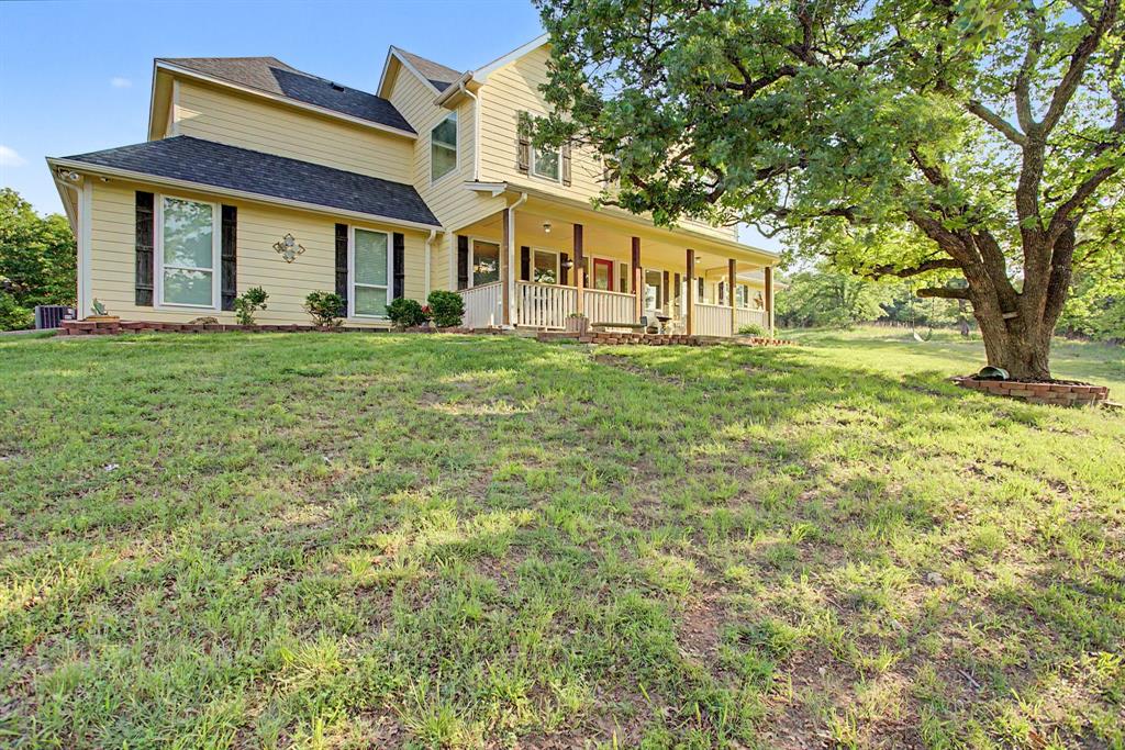 203 Saddle Ridge Court Springtown, TX 76082 - Photo 2 of 39 Actually, I have always wanted a sweet yellow farmhouse with a brand new Class III hail resistant roof!