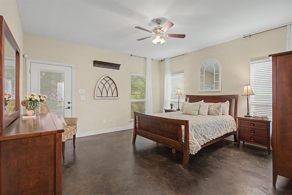 203 Saddle Ridge Court Springtown, TX 76082 - Photo 21 of 39 Welcome to the primary suite! Softly lit with plenty of natural light.