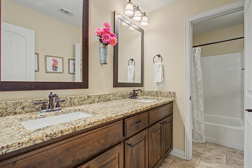203 Saddle Ridge Court Springtown, TX 76082 - Photo 28 of 39 Y'all we have SMART bathroom layouts with dual sinks and separate wet areas.