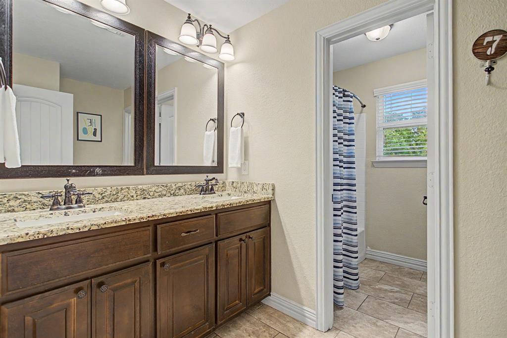 203 Saddle Ridge Court Springtown, TX 76082 - Photo 31 of 39 Another bathroom. Double sinks. Separate shower. Separate toilet. Maximum functionality!!!
