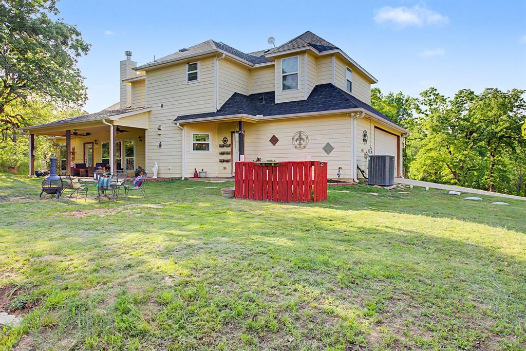 203 Saddle Ridge Court Springtown, TX 76082 - Photo 34 of 39 Lovely, SHADY backyard. Emphasis on shade.