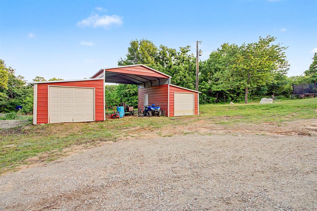 203 Saddle Ridge Court Springtown, TX 76082 - Photo 37 of 39 Red barn plus RV hookups. For all your farm stuff!