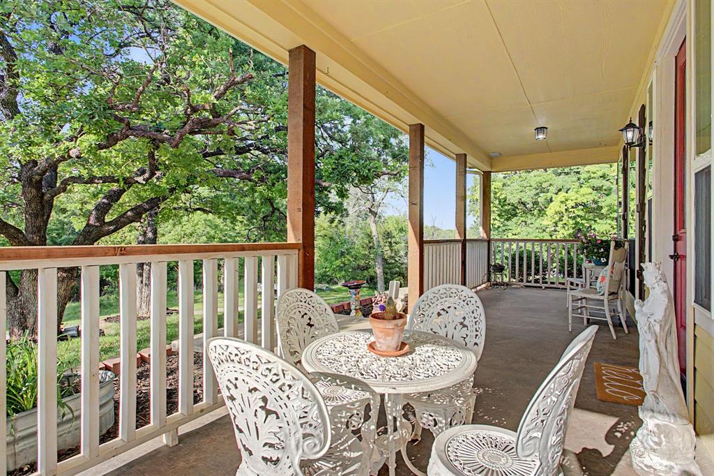 203 Saddle Ridge Court Springtown, TX 76082 - Photo 5 of 39 Inviting. Welcoming. Charming. Got that good feeling. Home.