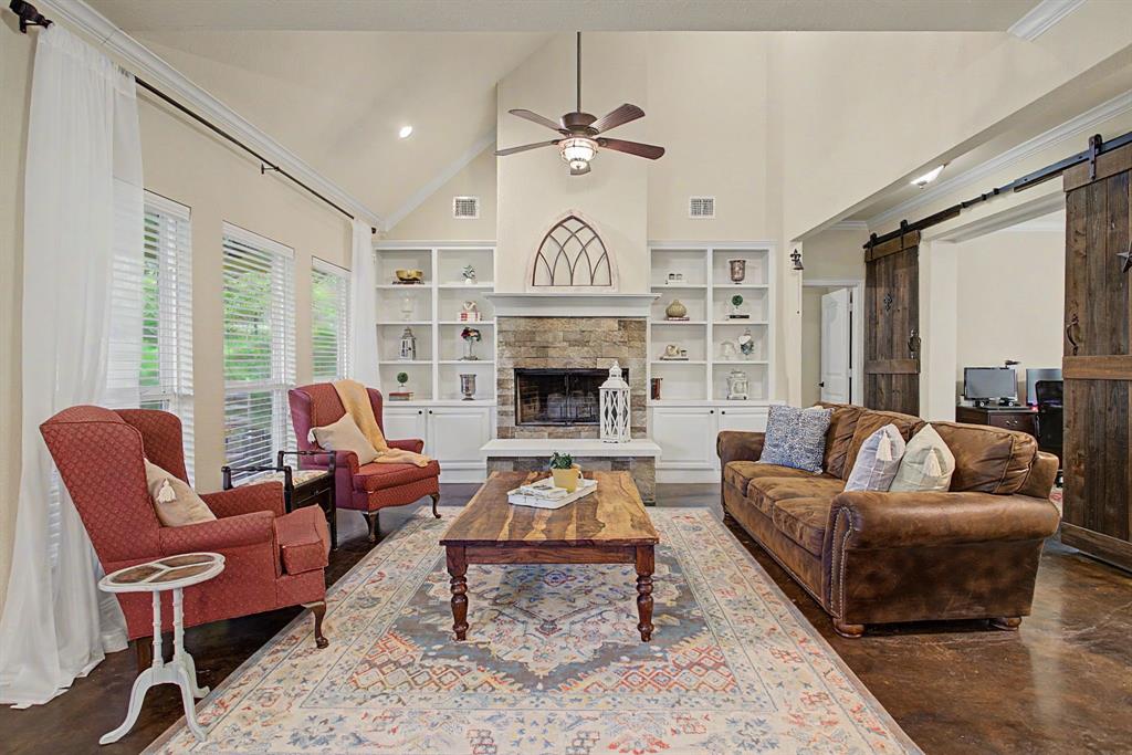 203 Saddle Ridge Court Springtown, TX 76082 - Photo 7 of 39 The stone fireplace is gorgeous. The built-ins are striking. The foam insulation. Also very cool.