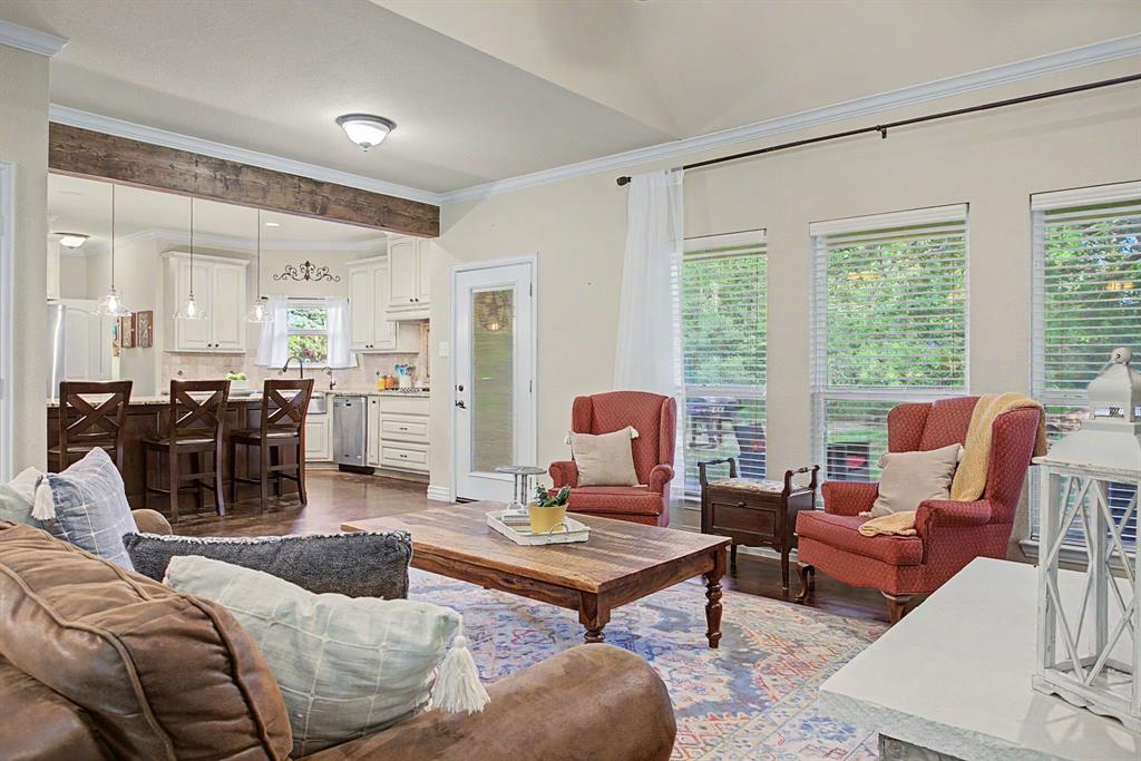 203 Saddle Ridge Court Springtown, TX 76082 - Photo 9 of 39 And yes - the views to the backyard are gorgeous and peaceful and SO GREEN right now!