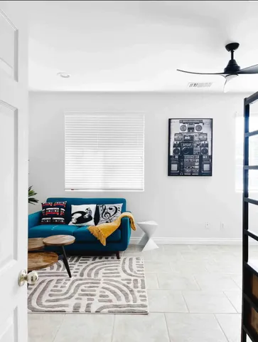 a living room with furniture and window