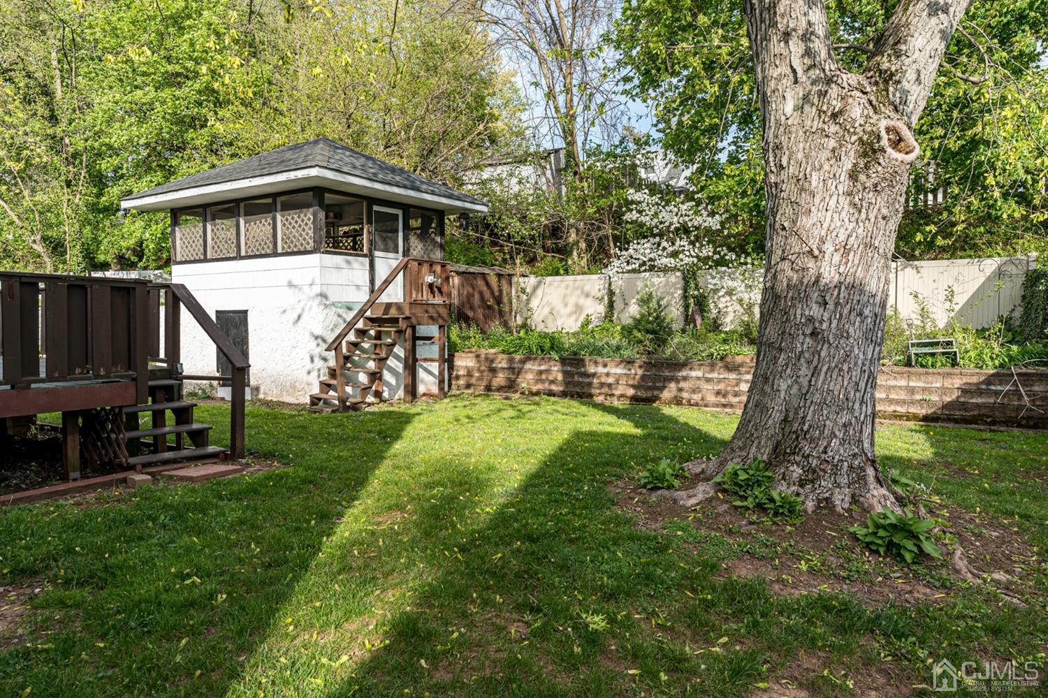 186 McFarlane Road Colonia, NJ 07067 - Photo 22 of 22 a view of a house with backyard and a tree
