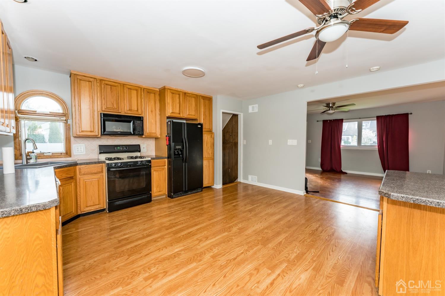186 McFarlane Road Colonia, NJ 07067 - Photo 5 of 22 a view of a kitchen with a stove cabinets and a kitchen view