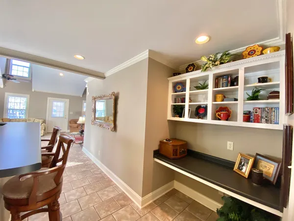 a bedroom with a bed and ceiling fan