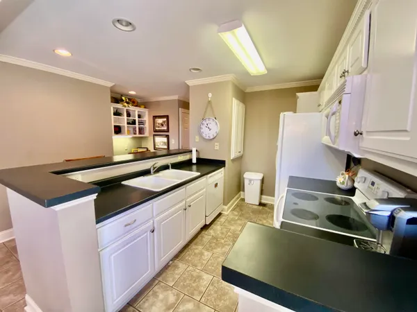 a spacious bathroom with a double vanity sink and a mirror