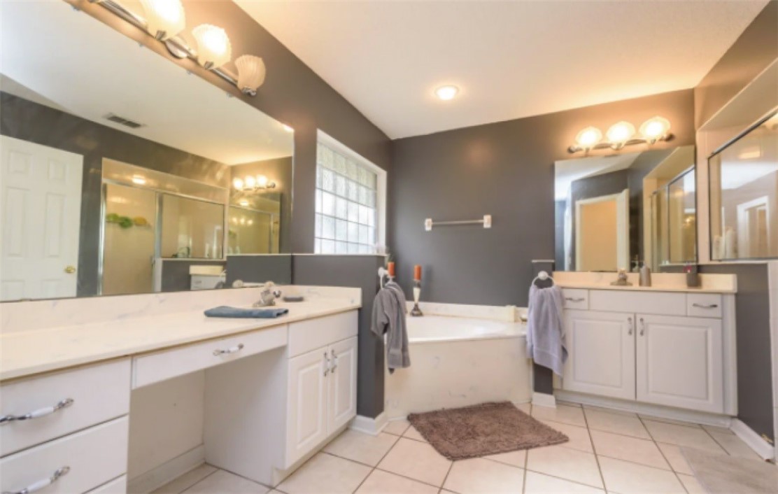 75020 Edwards Road Yulee, FL 32097 - Photo 6 of 6 a bathroom with a sink a tub and a mirror