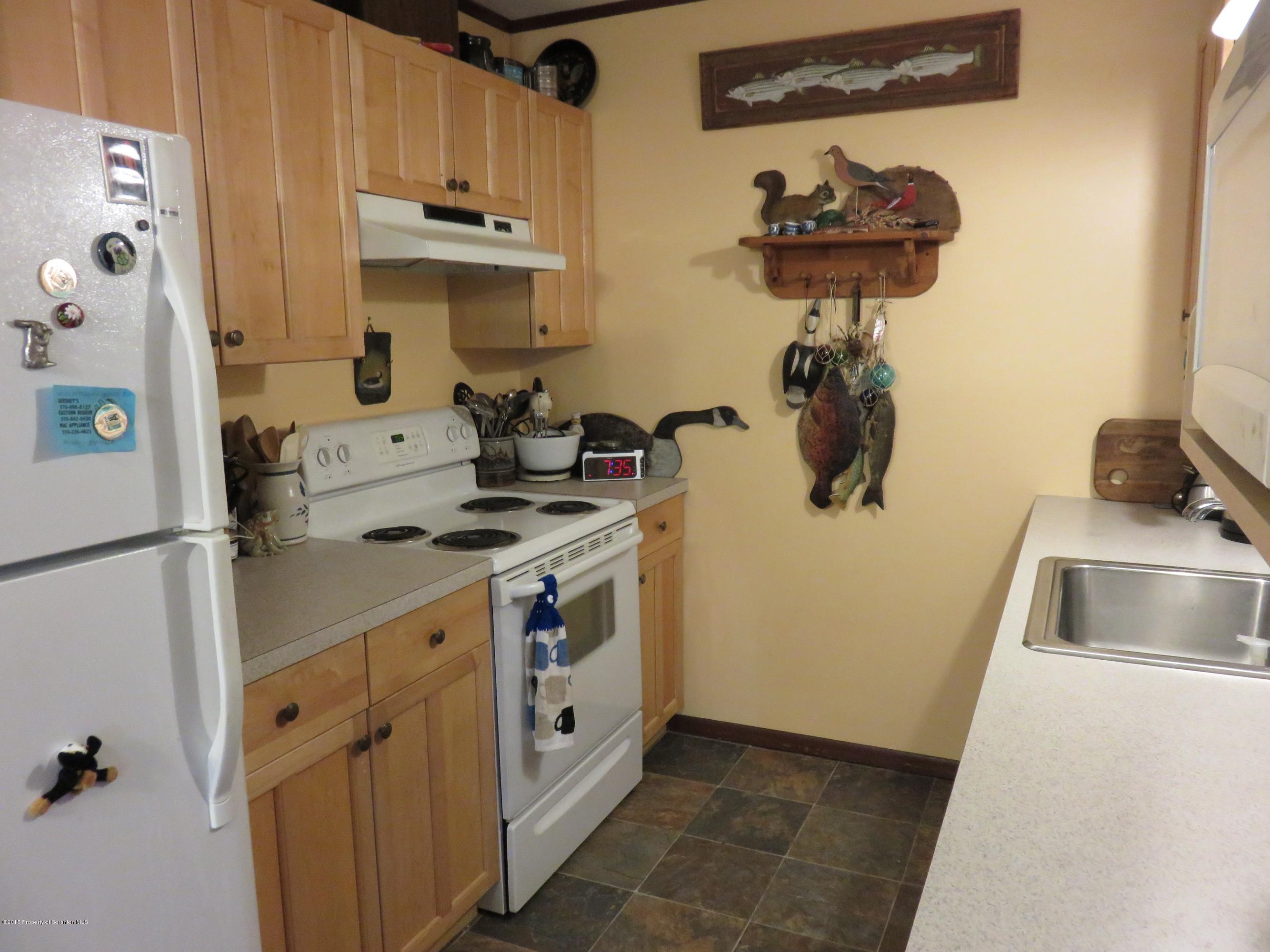 47 Pump House Road Lake Ariel, PA 18436 - Photo 3 of 22 a kitchen with a sink and a stove