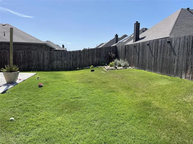 a view of a backyard with a garden