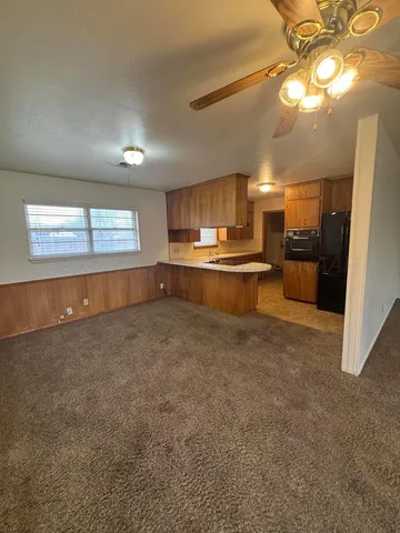 a view of a kitchen and a window