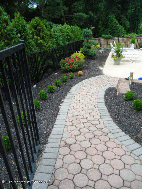 129 Ballantine Road Middletown, NJ 07748 - Photo 29 of 33 a view of a backyard with pathway
