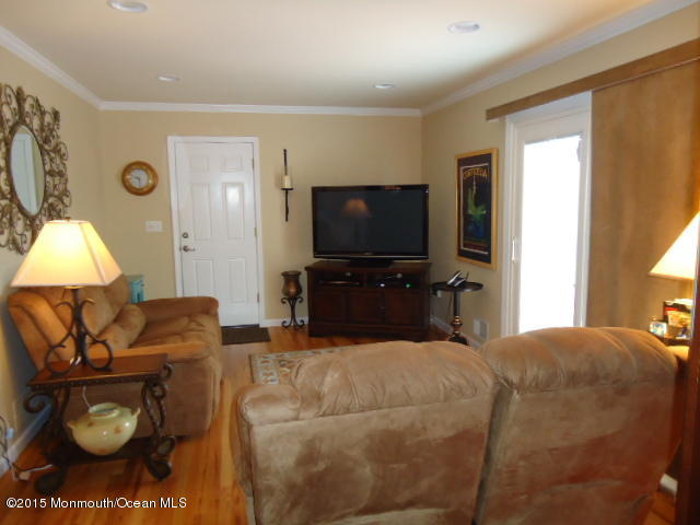 129 Ballantine Road Middletown, NJ 07748 - Photo 5 of 33 a living room with furniture and a flat screen tv