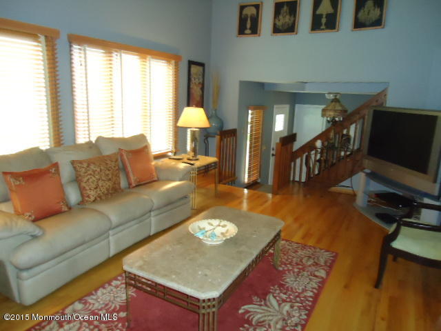 129 Ballantine Road Middletown, NJ 07748 - Photo 7 of 33 a living room with furniture and a flat screen tv