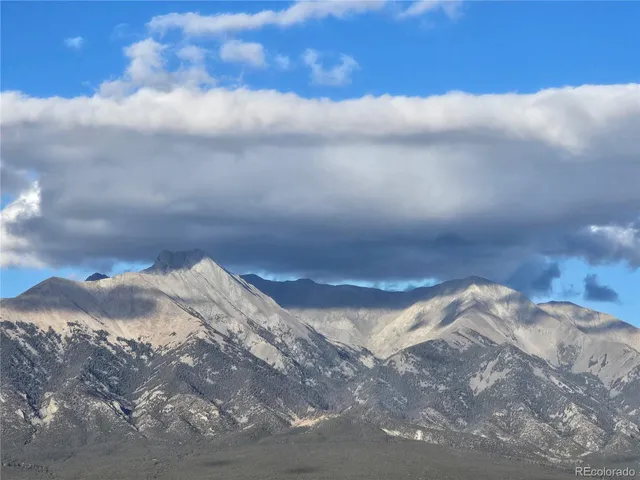 a view of a house with a mountain