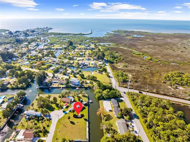 an aerial view of residential building and lake