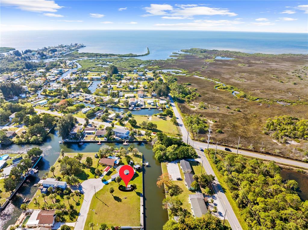 an aerial view of residential building and lake