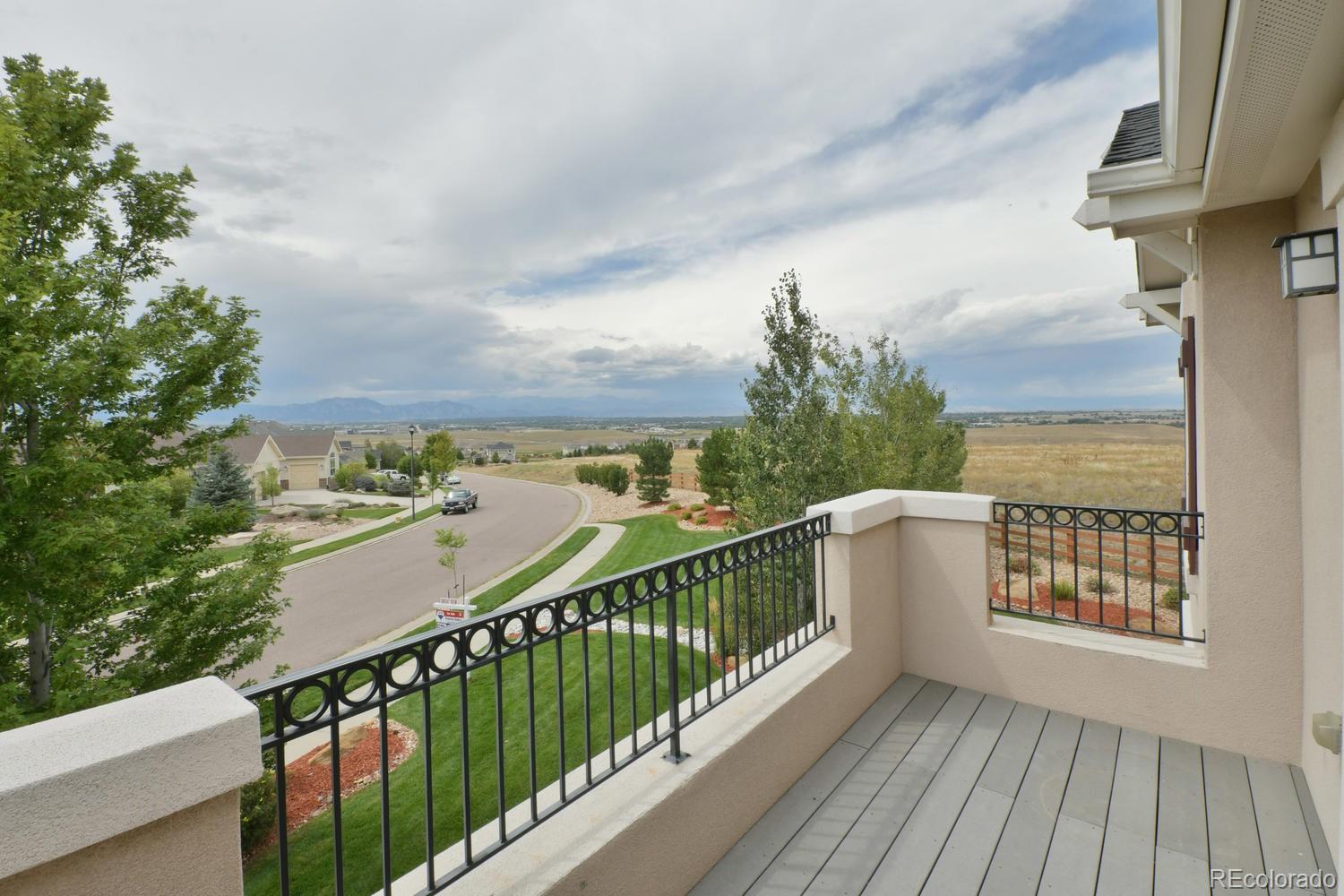 4939 Silver Feather Circle Broomfield, CO 80023 - Photo 18 of 35 a view of a balcony with wooden floor