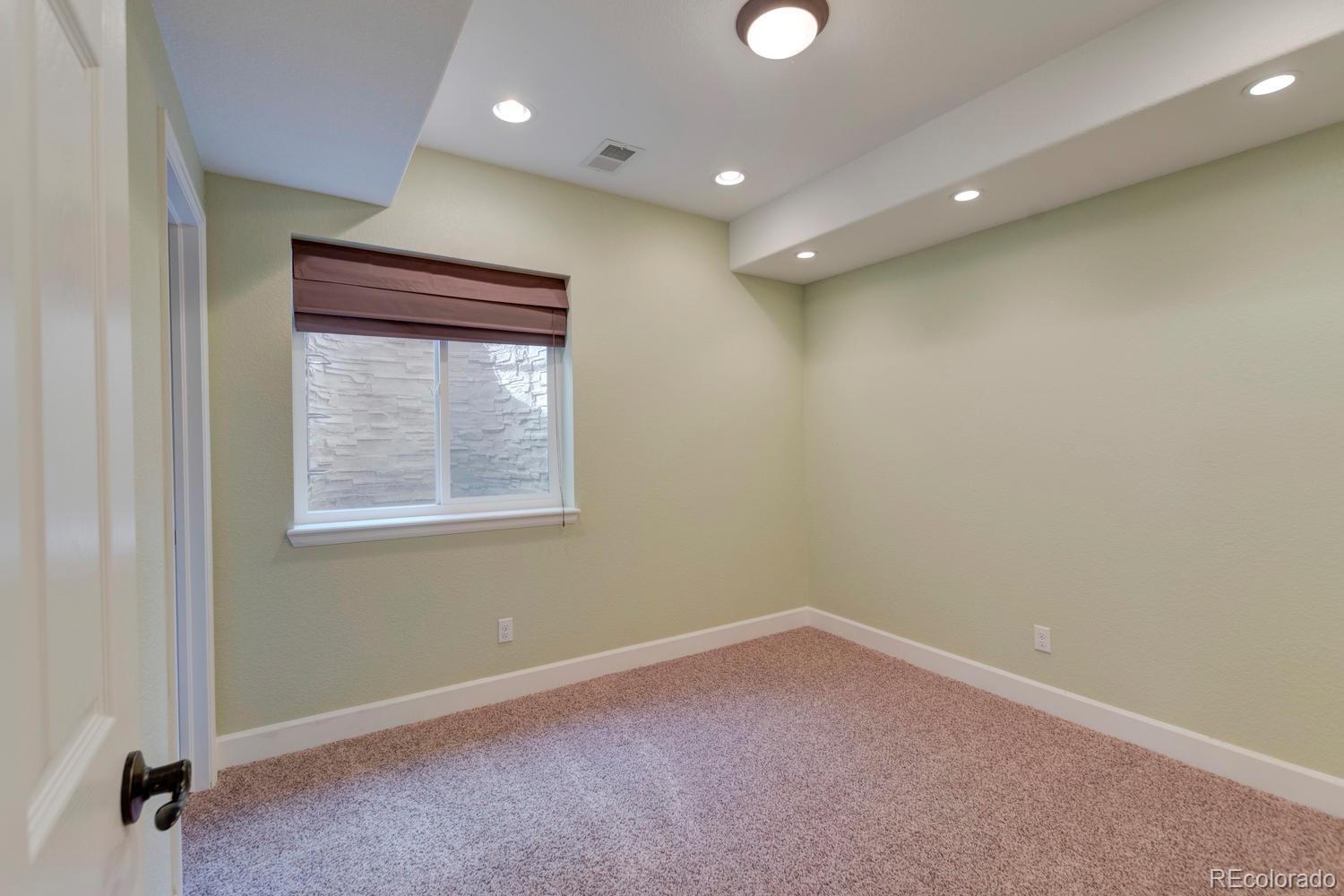 4939 Silver Feather Circle Broomfield, CO 80023 - Photo 25 of 35 an empty room with windows