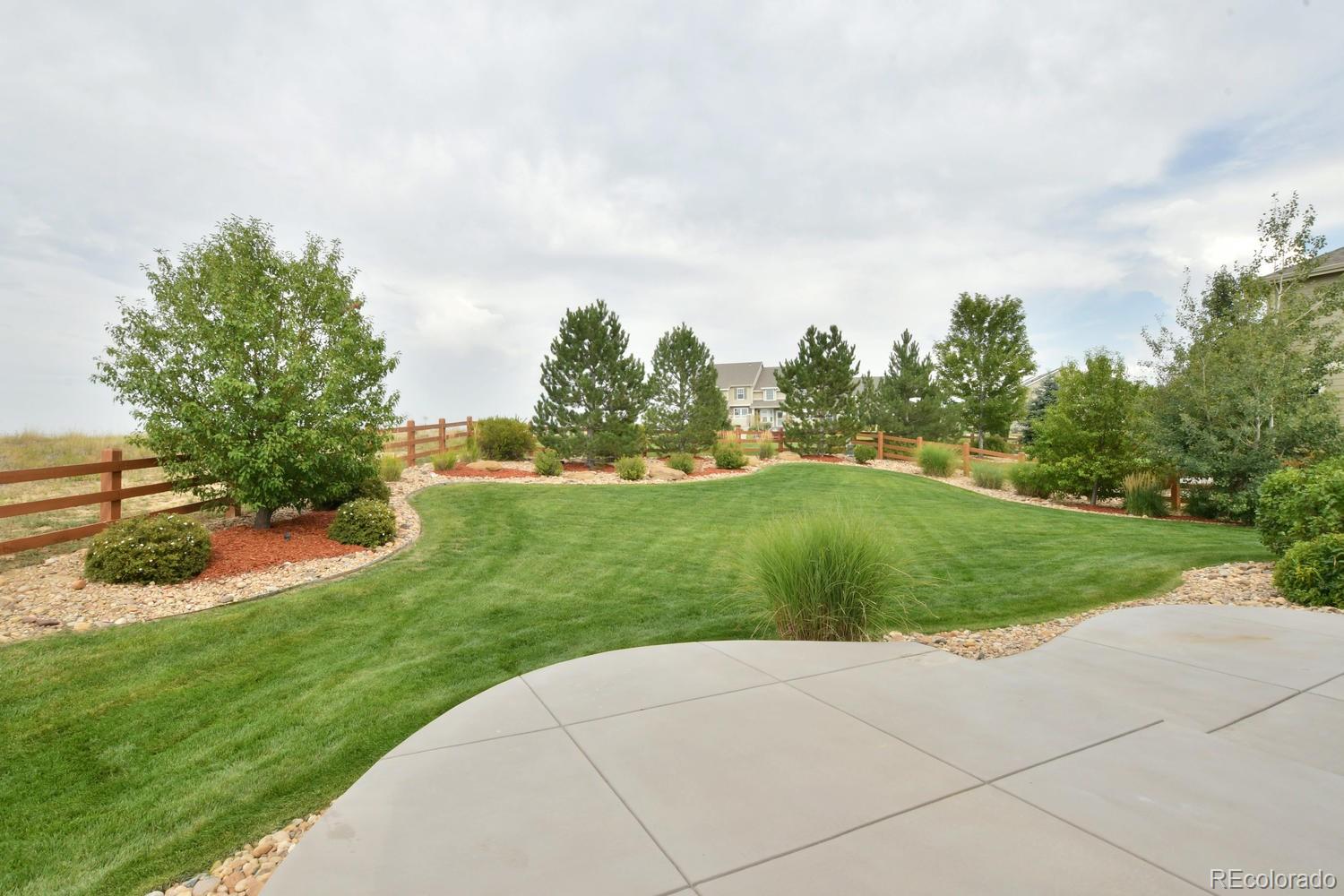 4939 Silver Feather Circle Broomfield, CO 80023 - Photo 28 of 35 a view of a garden with plants and a pathway