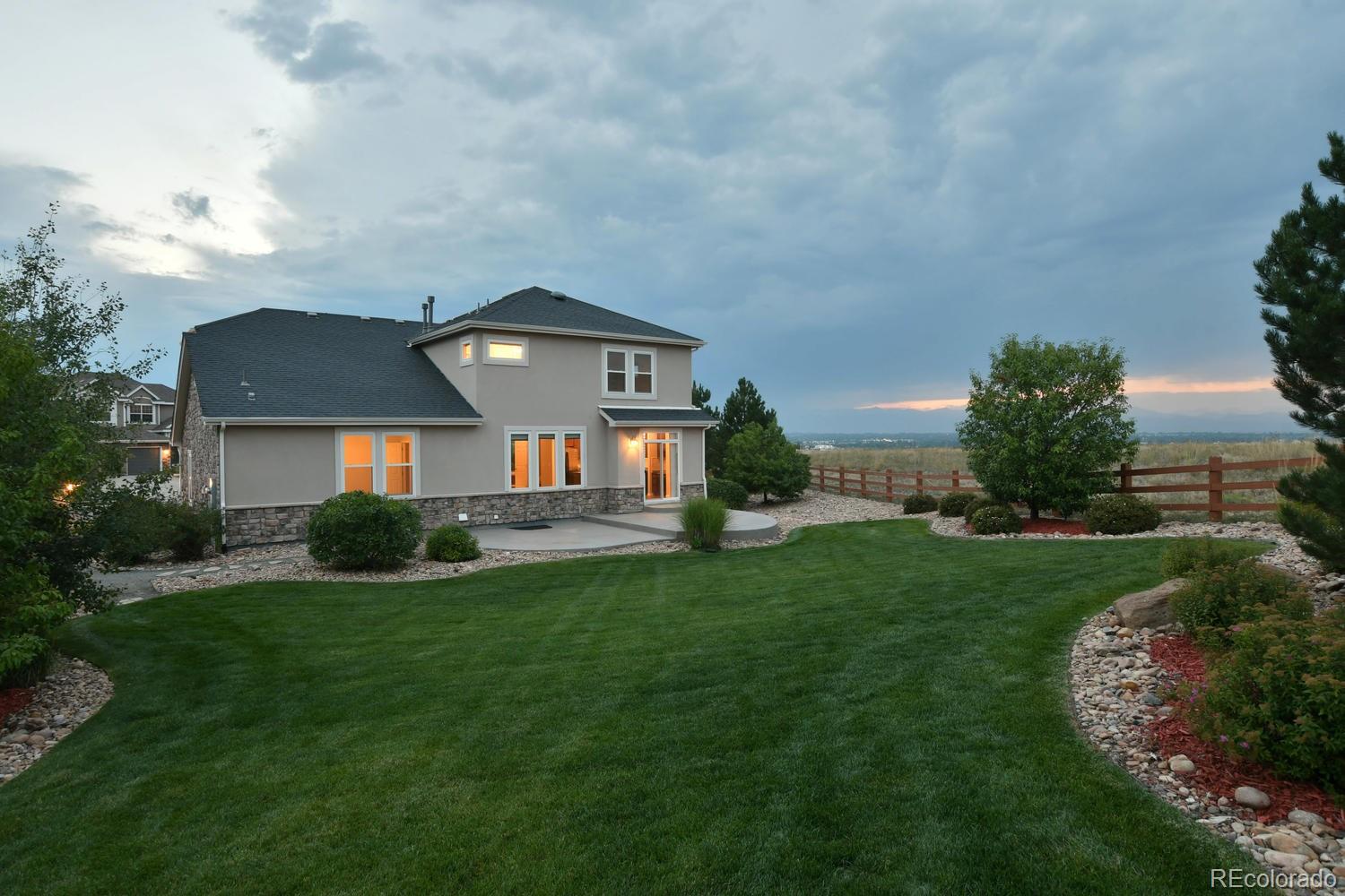 4939 Silver Feather Circle Broomfield, CO 80023 - Photo 29 of 35 a front view of a house with a yard
