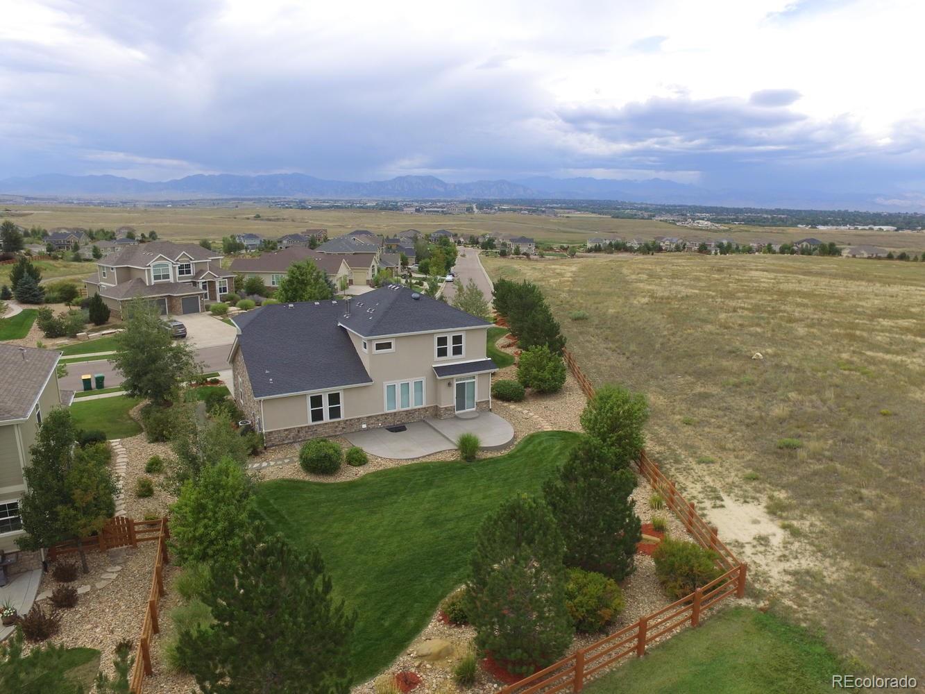 4939 Silver Feather Circle Broomfield, CO 80023 - Photo 4 of 35 an aerial view of residential houses with outdoor space and ocean view