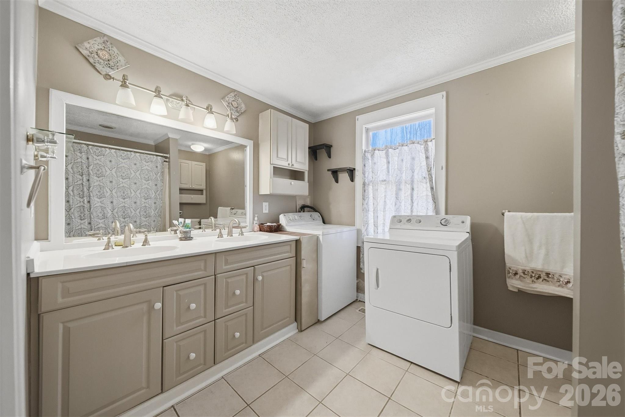621 Wildlife Lake Road Old Fort, NC 28762 - Photo 18 of 35 a bathroom with a double vanity sink and mirror