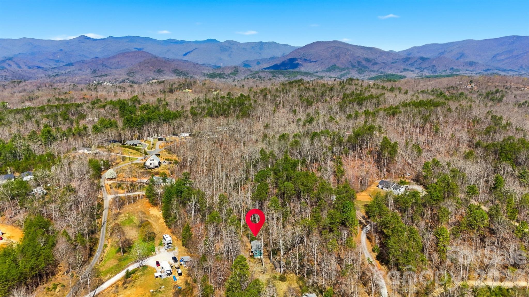 621 Wildlife Lake Road Old Fort, NC 28762 - Photo 2 of 35 a view of a lush green hillside and a houses