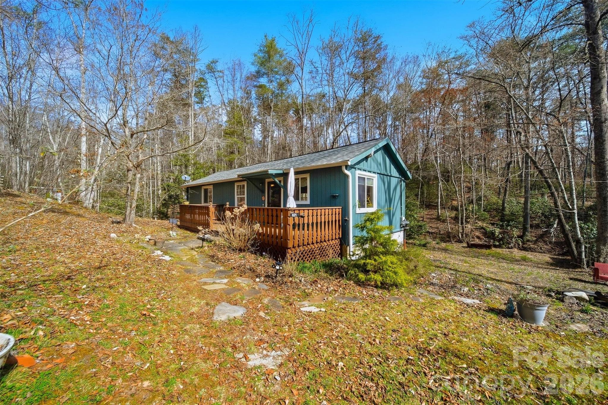 621 Wildlife Lake Road Old Fort, NC 28762 - Photo 25 of 35 a view of a house with a yard