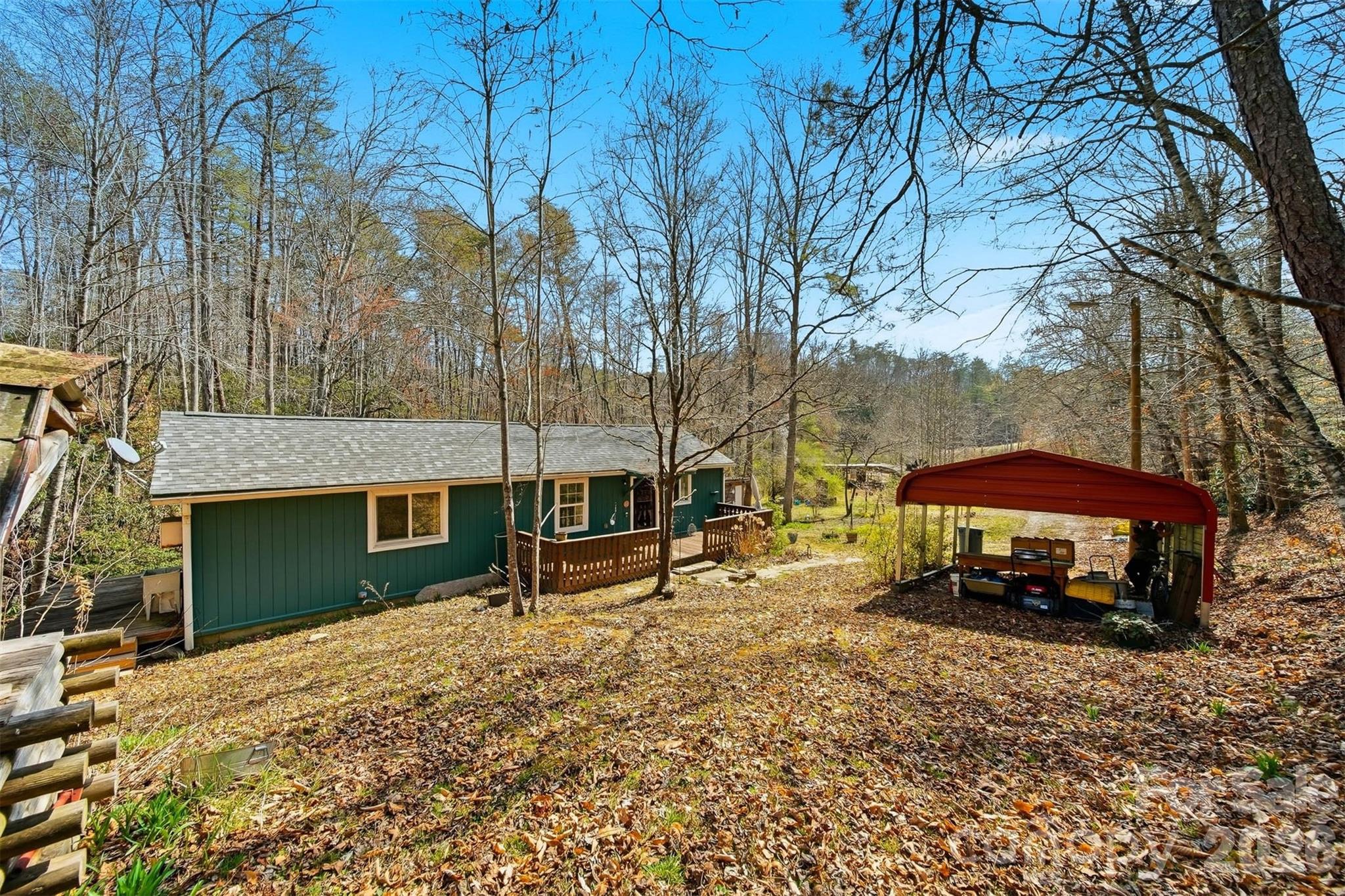 621 Wildlife Lake Road Old Fort, NC 28762 - Photo 27 of 35 a view of a house with a yard and sitting area
