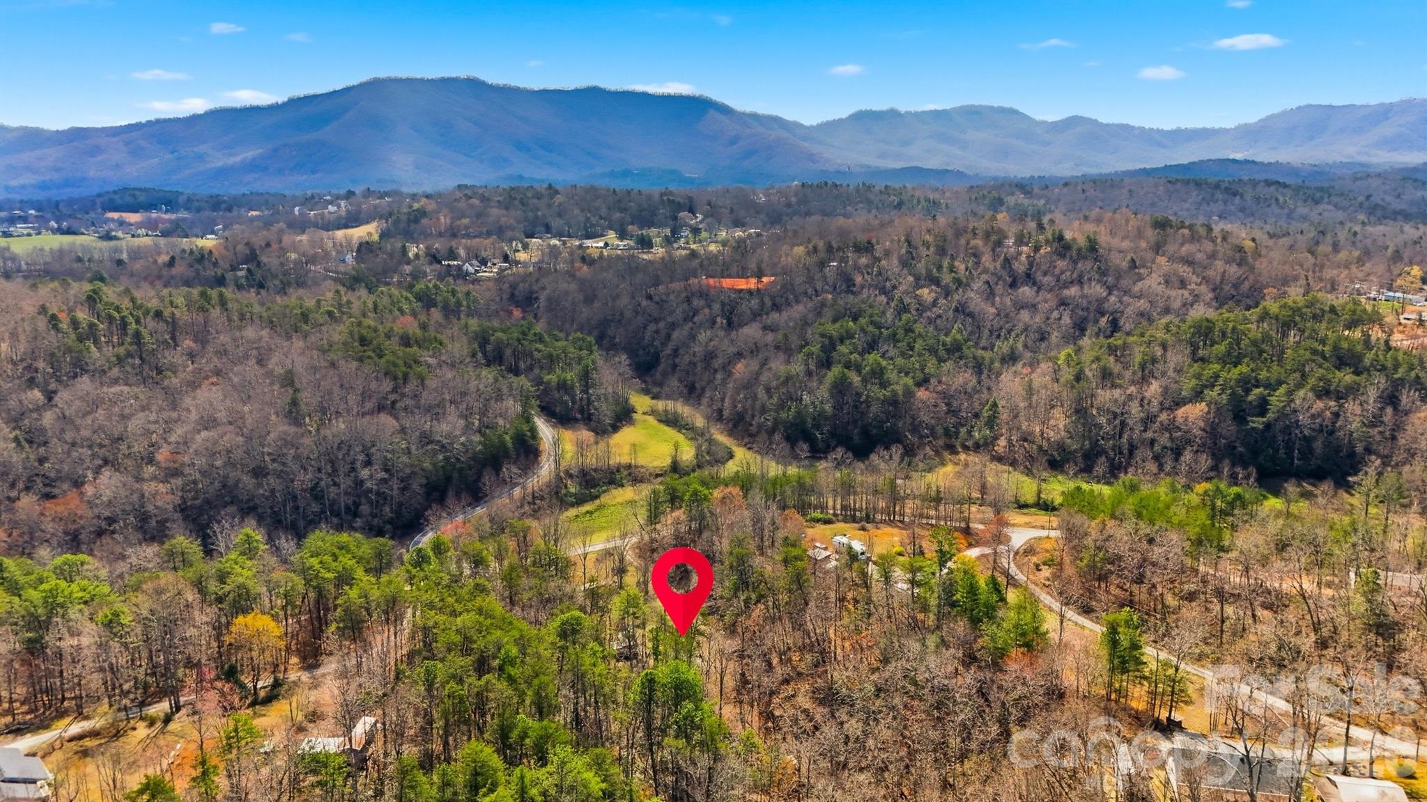 621 Wildlife Lake Road Old Fort, NC 28762 - Photo 32 of 35 a view of a lush green hillside and a houses