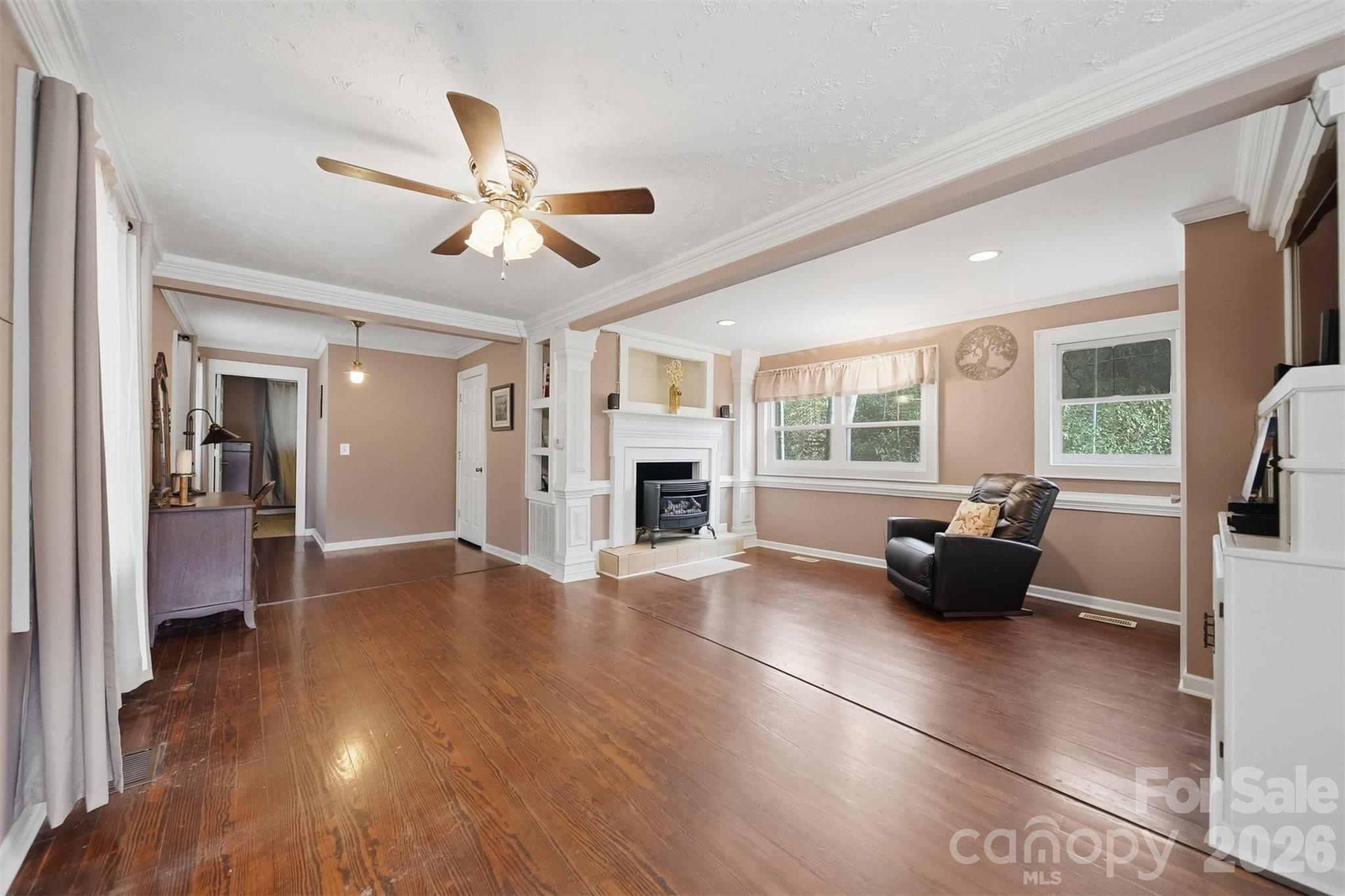 621 Wildlife Lake Road Old Fort, NC 28762 - Photo 4 of 35 a living room with furniture and a fireplace
