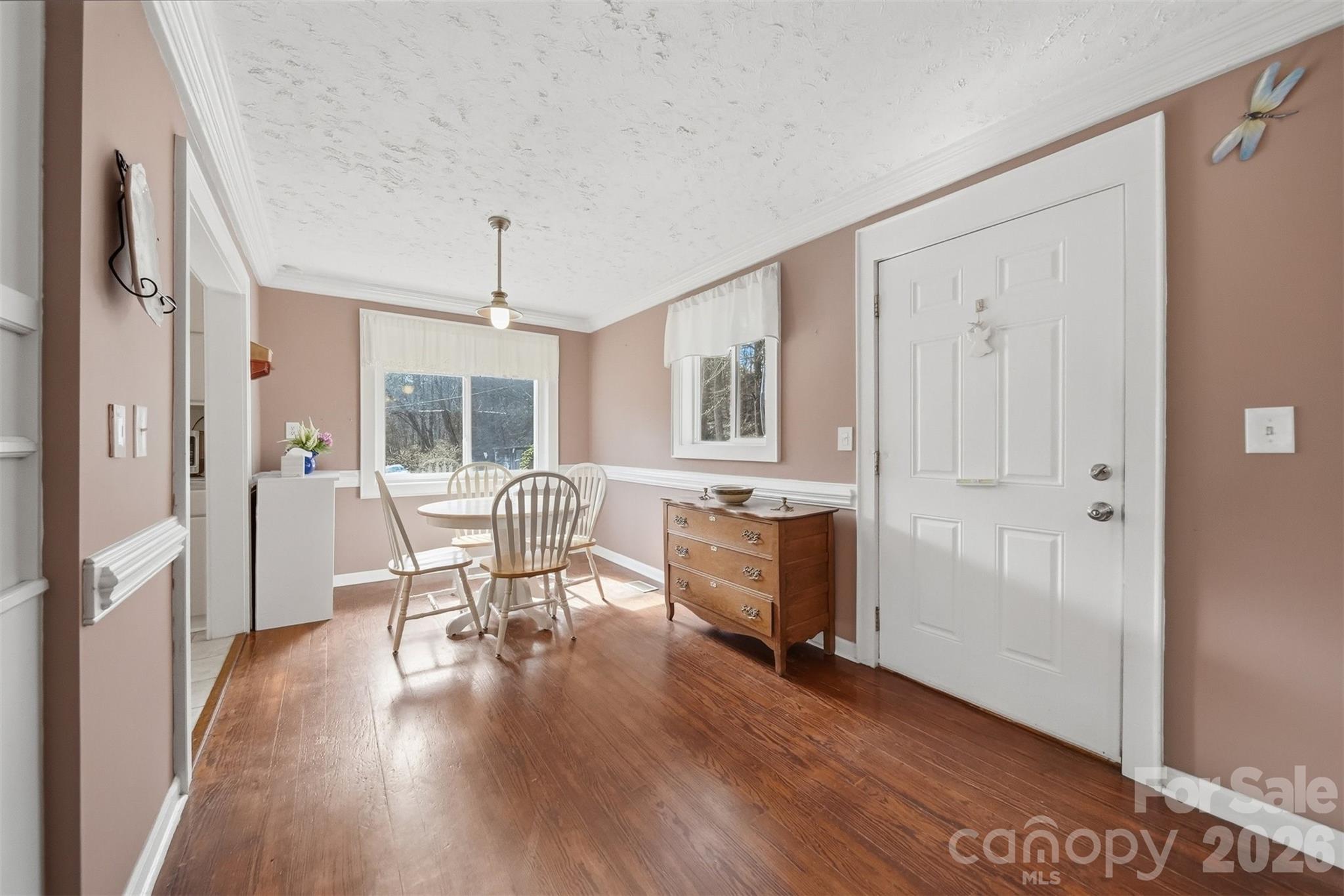 621 Wildlife Lake Road Old Fort, NC 28762 - Photo 8 of 35 a view of a dining room with furniture window and wooden floor