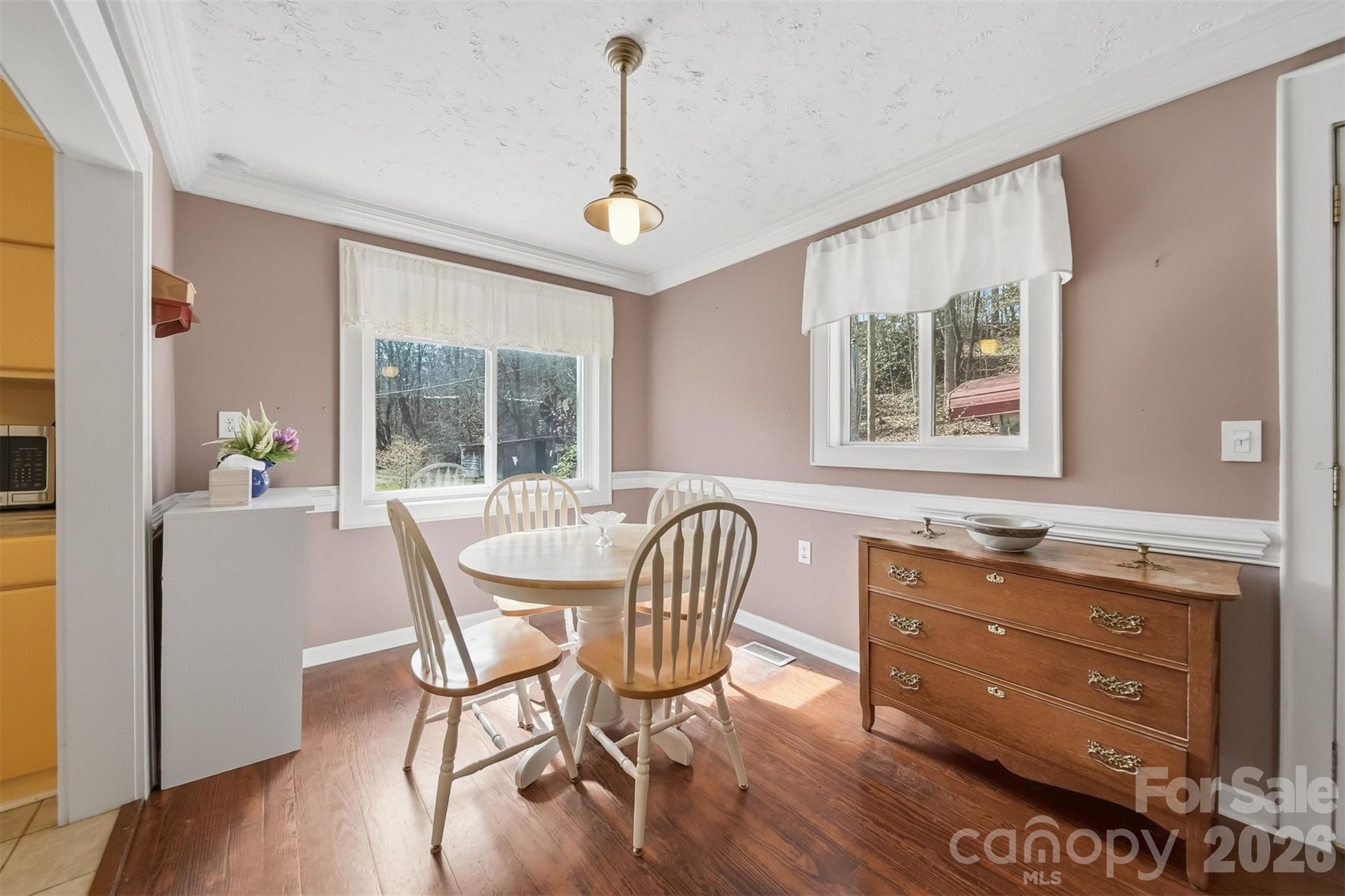 621 Wildlife Lake Road Old Fort, NC 28762 - Photo 10 of 35 a dining room with furniture a chandelier and wooden floor