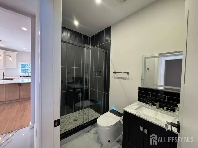 a view of entryway with stairs and wooden floor