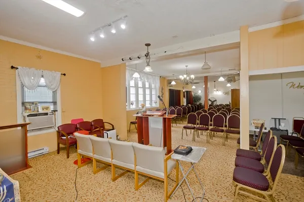 a living room with furniture and a table