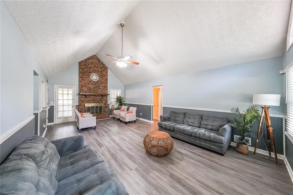 820 Bridgewater Way Southeast Conyers, GA 30094 - Photo 2 of 19 a living room with furniture and a fireplace