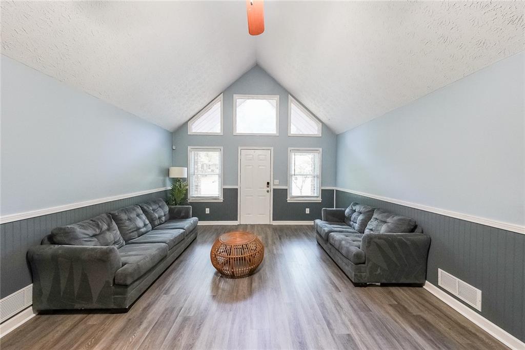 820 Bridgewater Way Southeast Conyers, GA 30094 - Photo 4 of 19 a living room with furniture and a large window