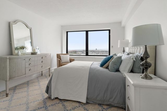 a bed room with a bed and a window