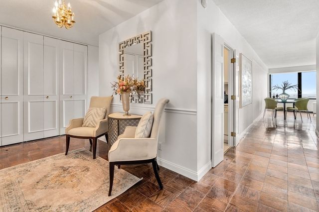 a view of a livingroom with furniture and a table