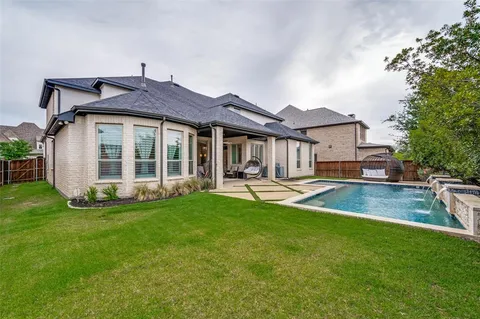 a view of a house with a yard porch and sitting area